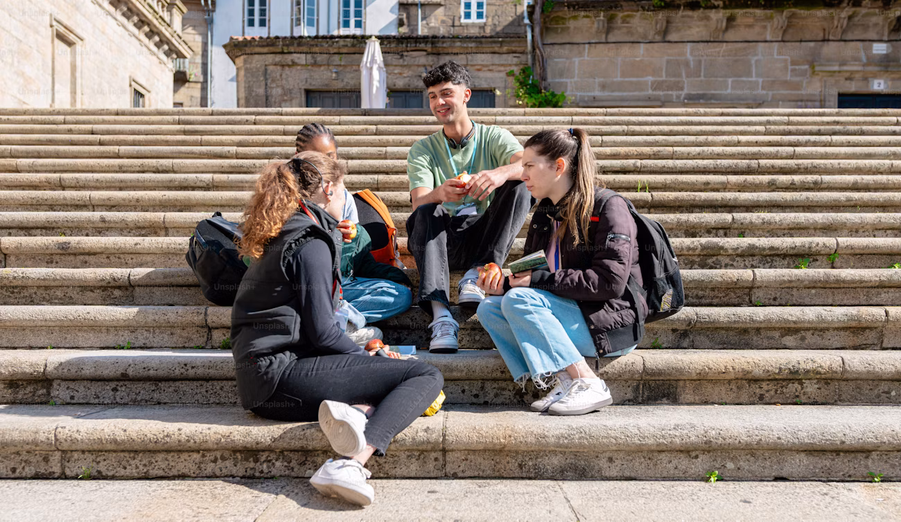 International students talking together on campus steps